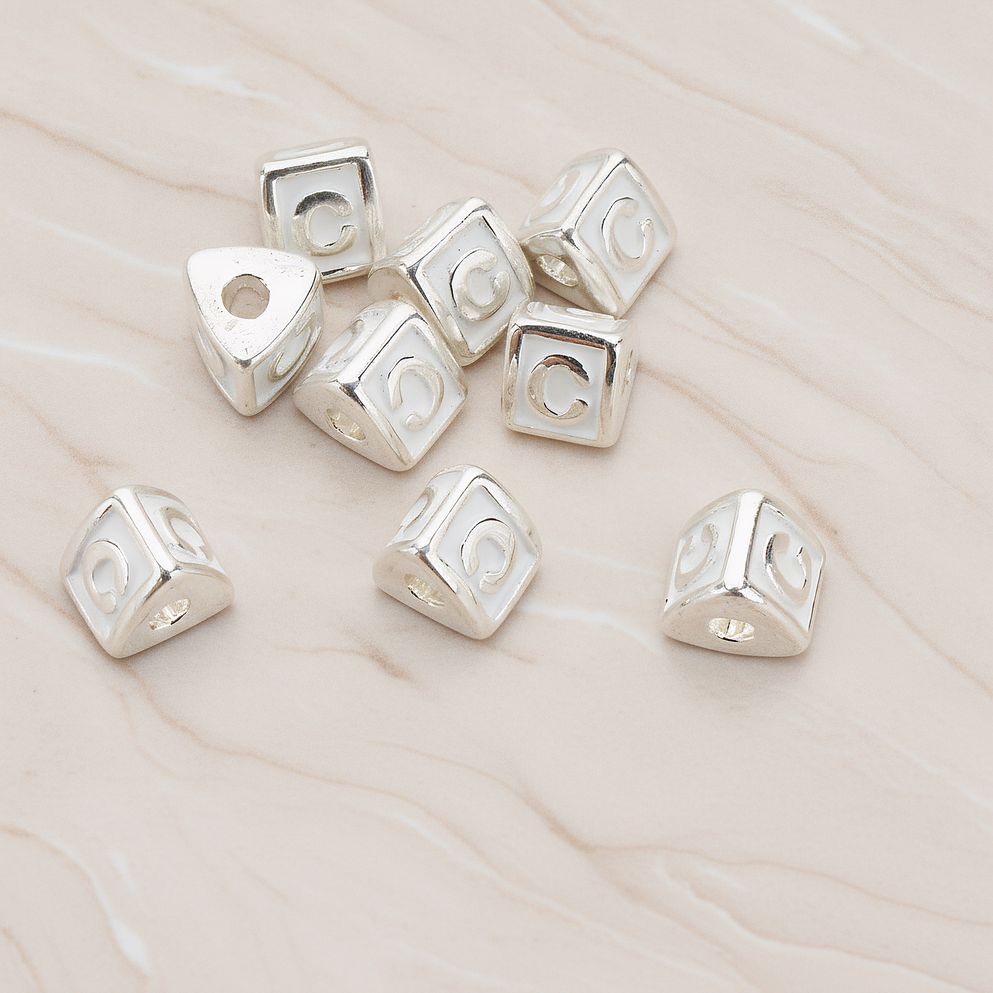 Triangle Cube Initial Metal Bead, 2 Pc on warm marble background (PD.1136)