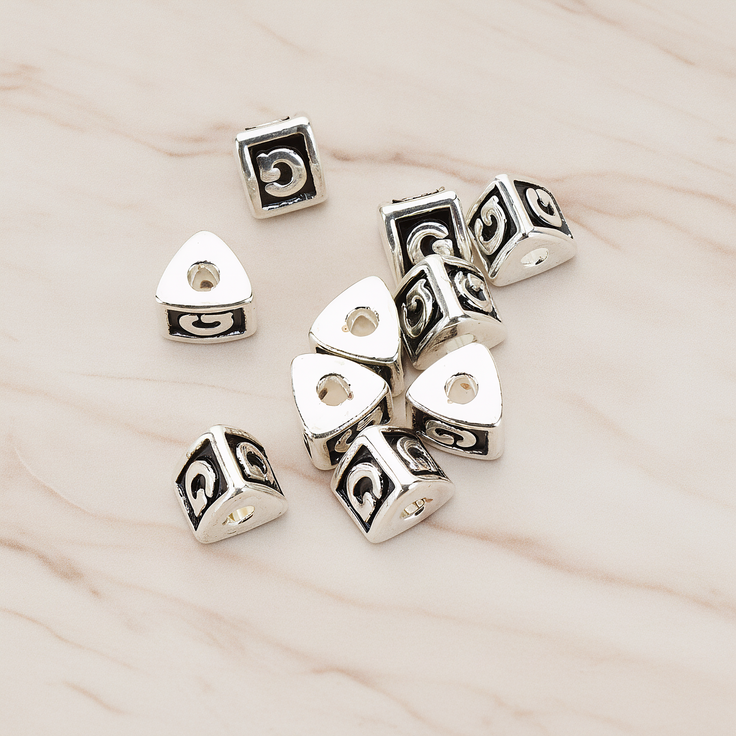 Triangle Cube Initial Metal Bead, 2 Pc on warm marble background (PD.1136)