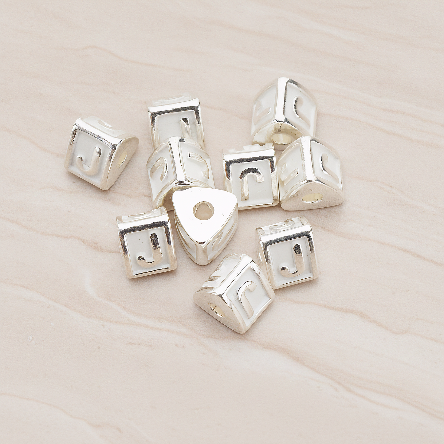 Triangle Cube Initial Metal Bead, 2 Pc on warm marble background (PD.1136)
