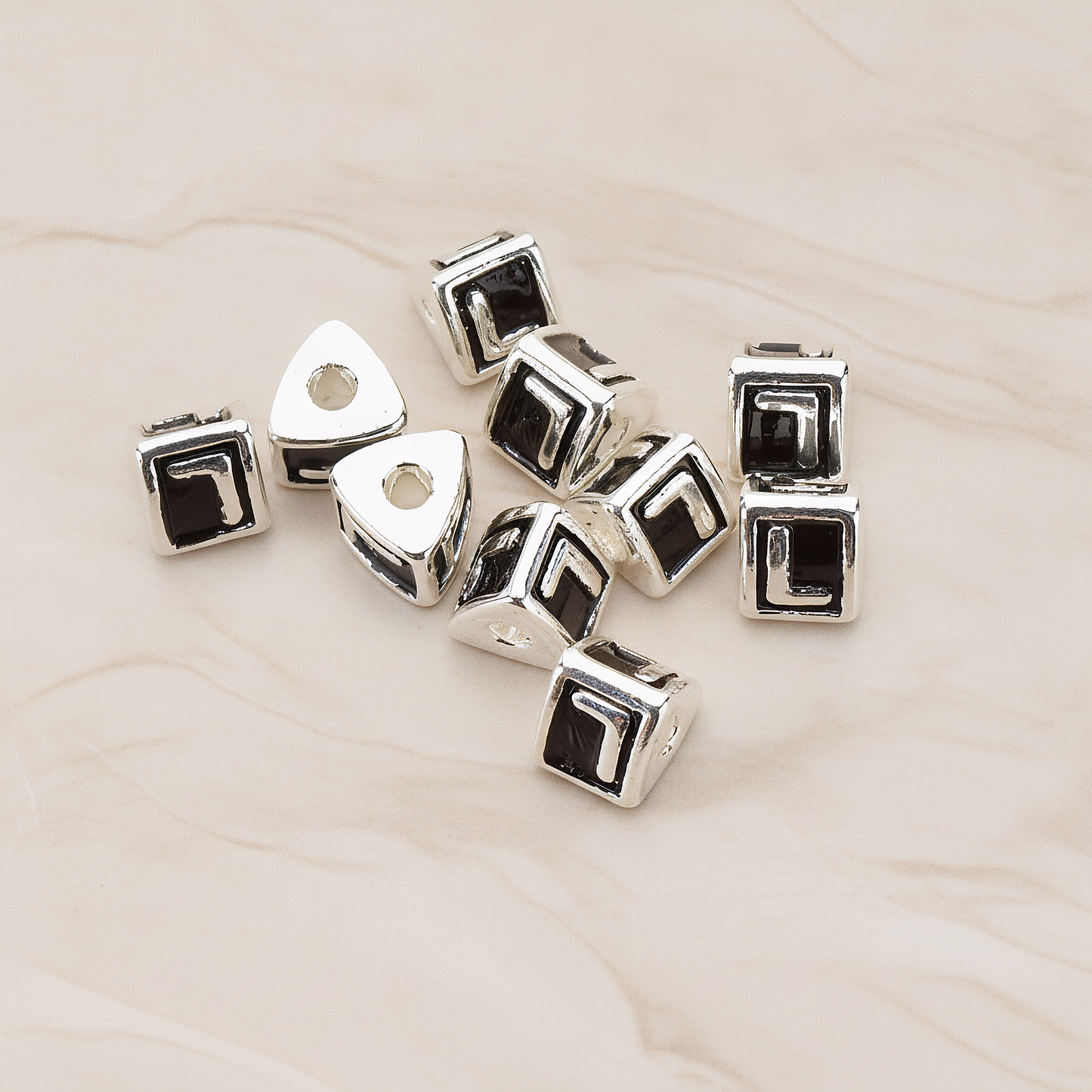 Triangle Cube Initial Metal Bead, 2 Pc on warm marble background (PD.1136)