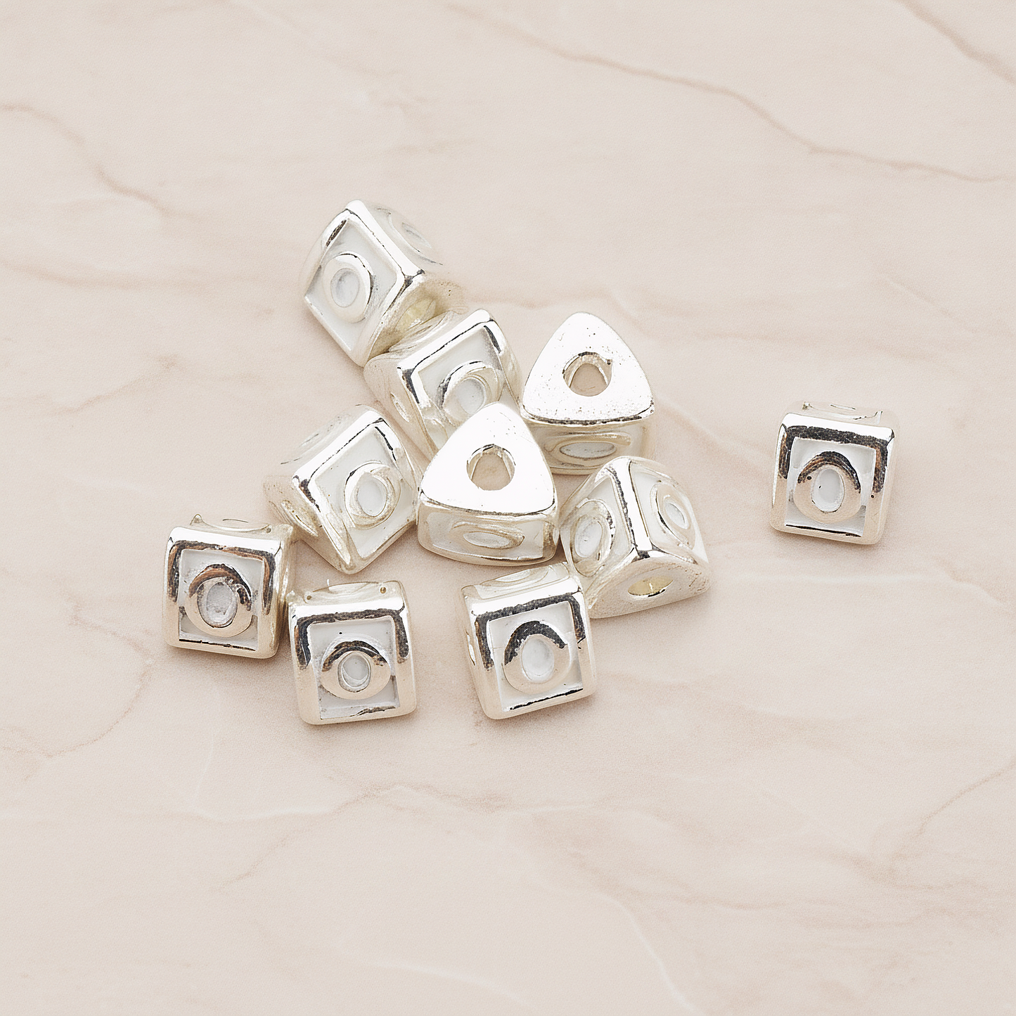Triangle Cube Initial Metal Bead, 2 Pc on warm marble background (PD.1136)