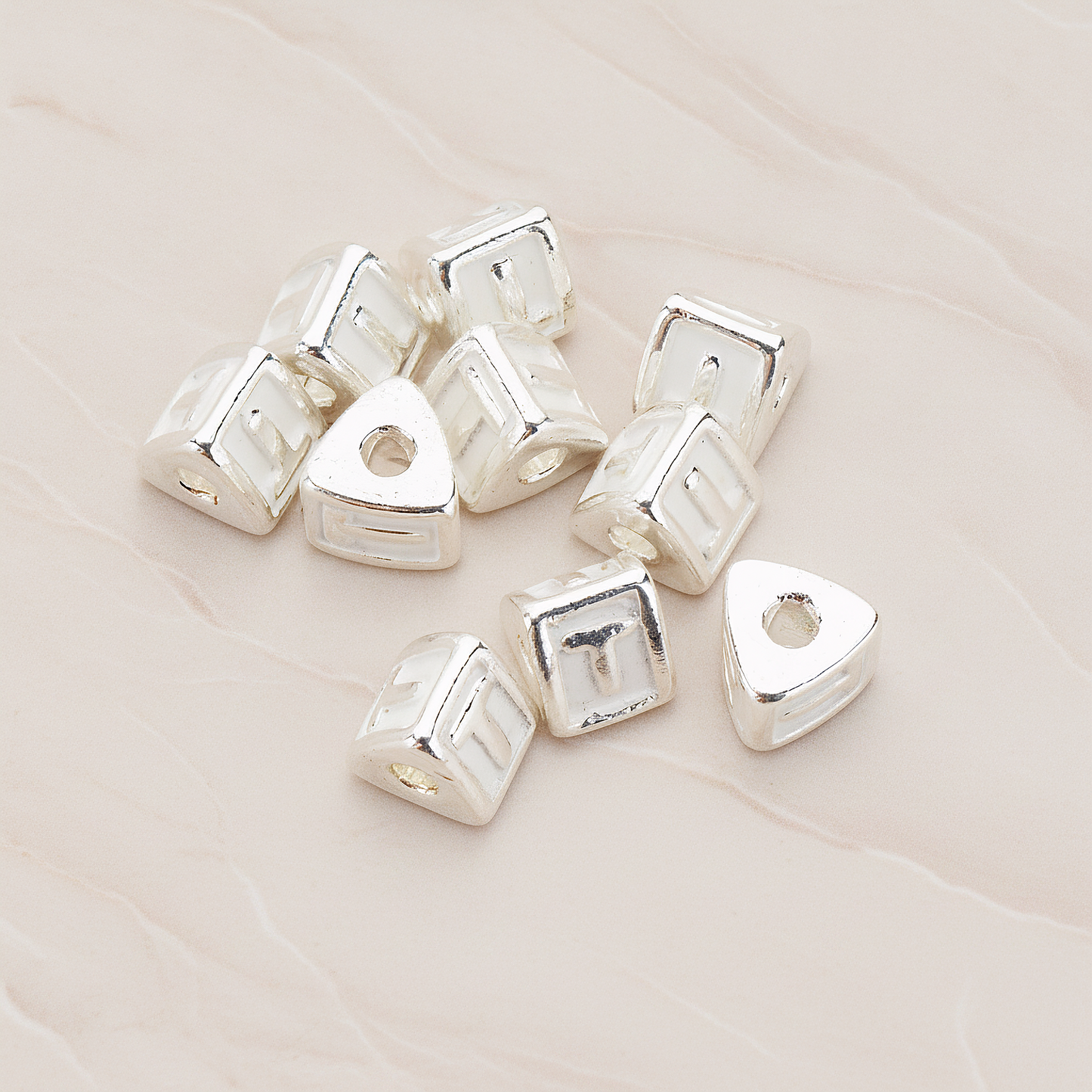 Triangle Cube Initial Metal Bead, 2 Pc on warm marble background (PD.1136)