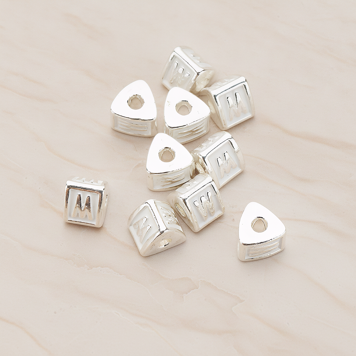 Triangle Cube Initial Metal Bead, 2 Pc on warm marble background (PD.1136)