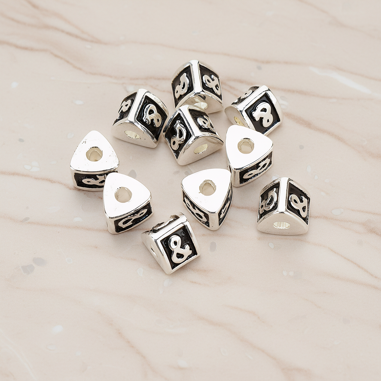Triangle Cube Initial Metal Bead, 2 Pc on warm marble background (PD.1136)