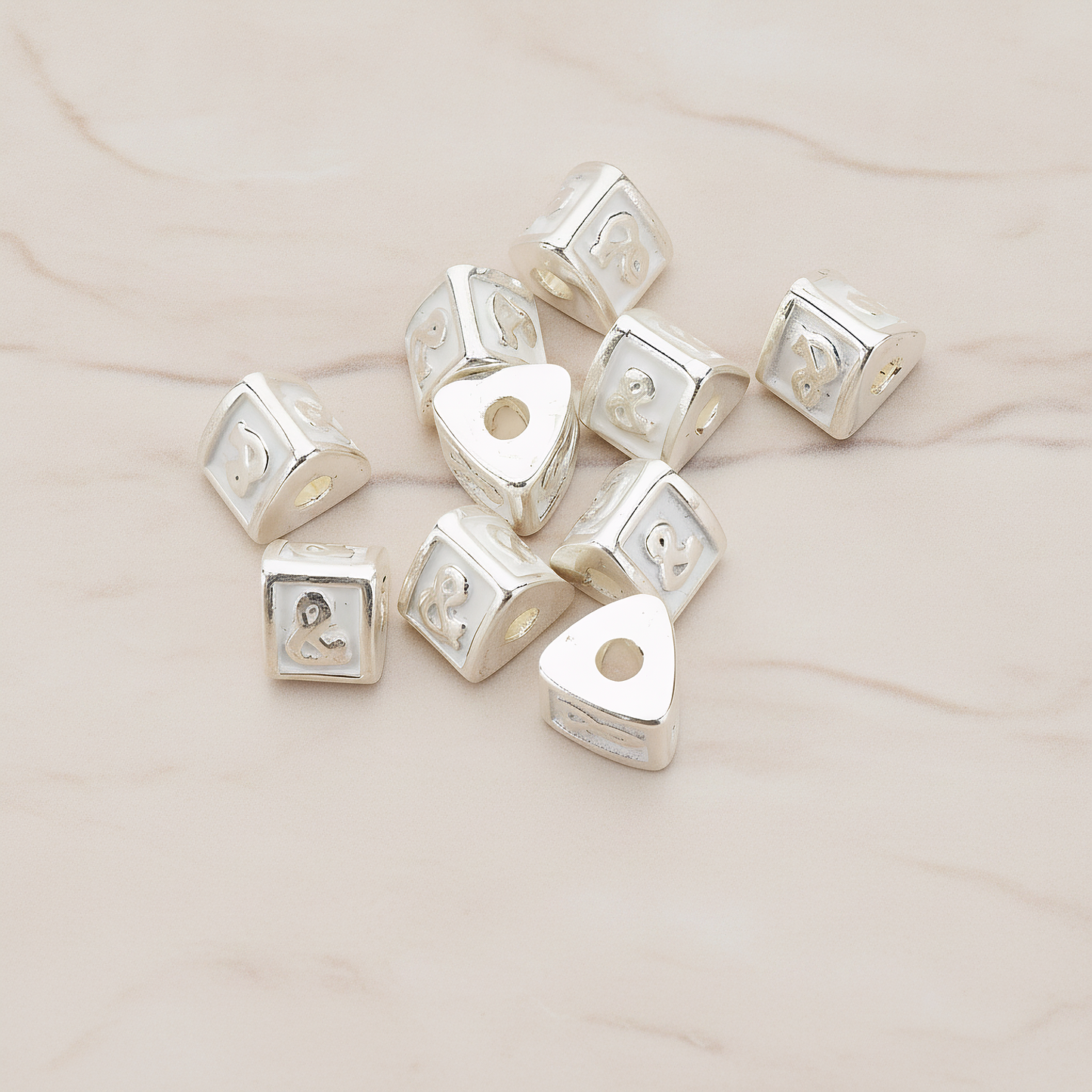 Triangle Cube Initial Metal Bead, 2 Pc on warm marble background (PD.1136)
