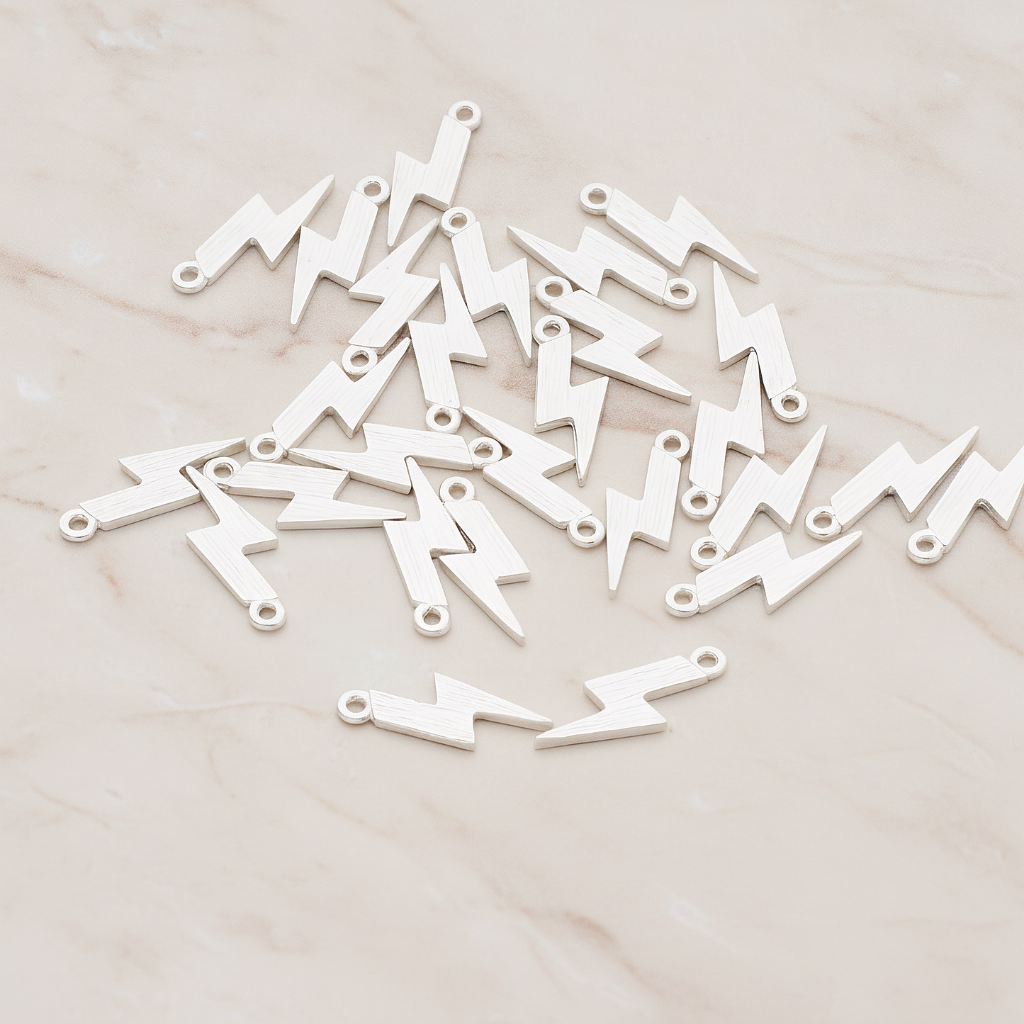 Brushed Lightening Pendant, 2 Pc on warm marble background (PD.1035)
