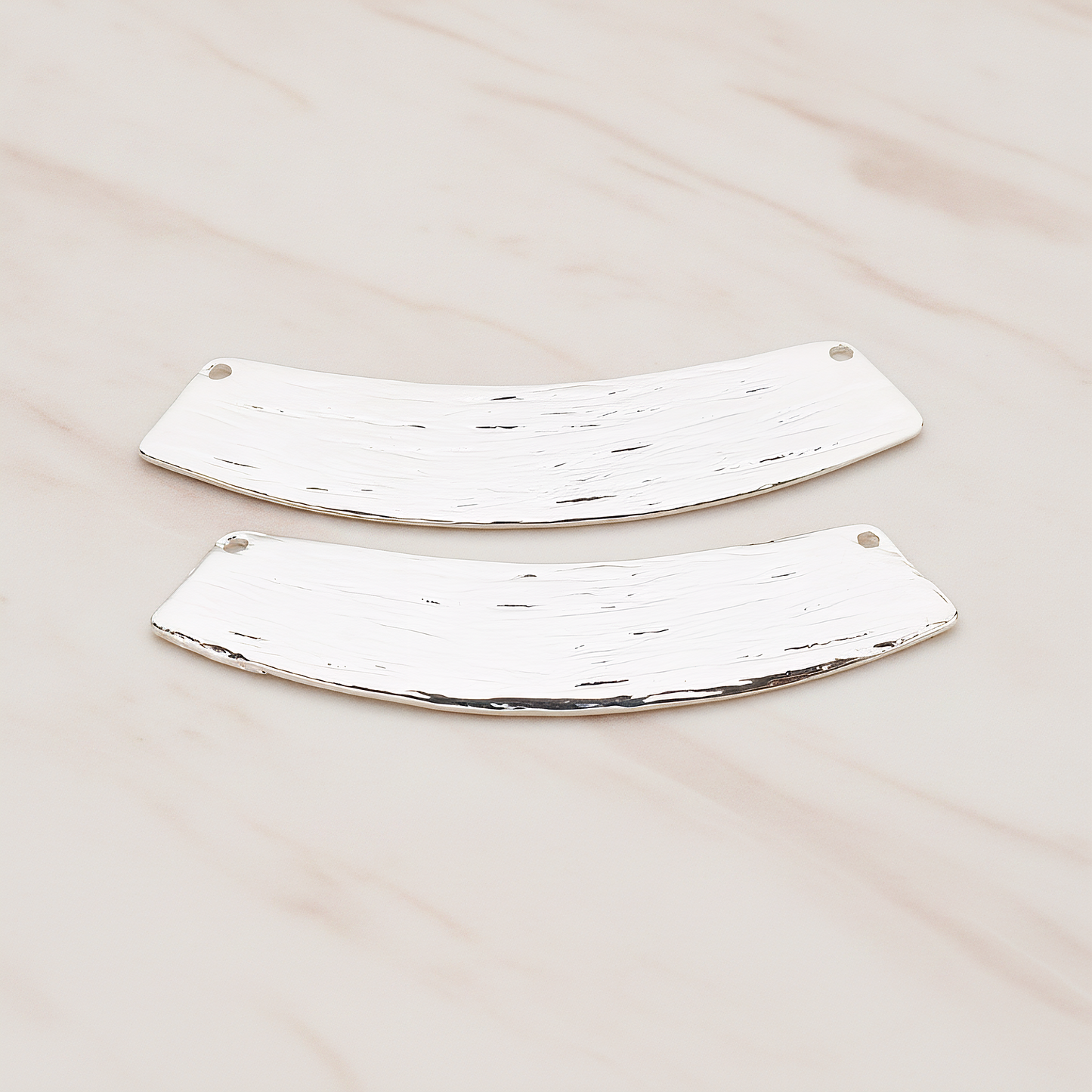 Curved Brushed Bar Pendant, 2 Pc on warm marble background (PD.1043)