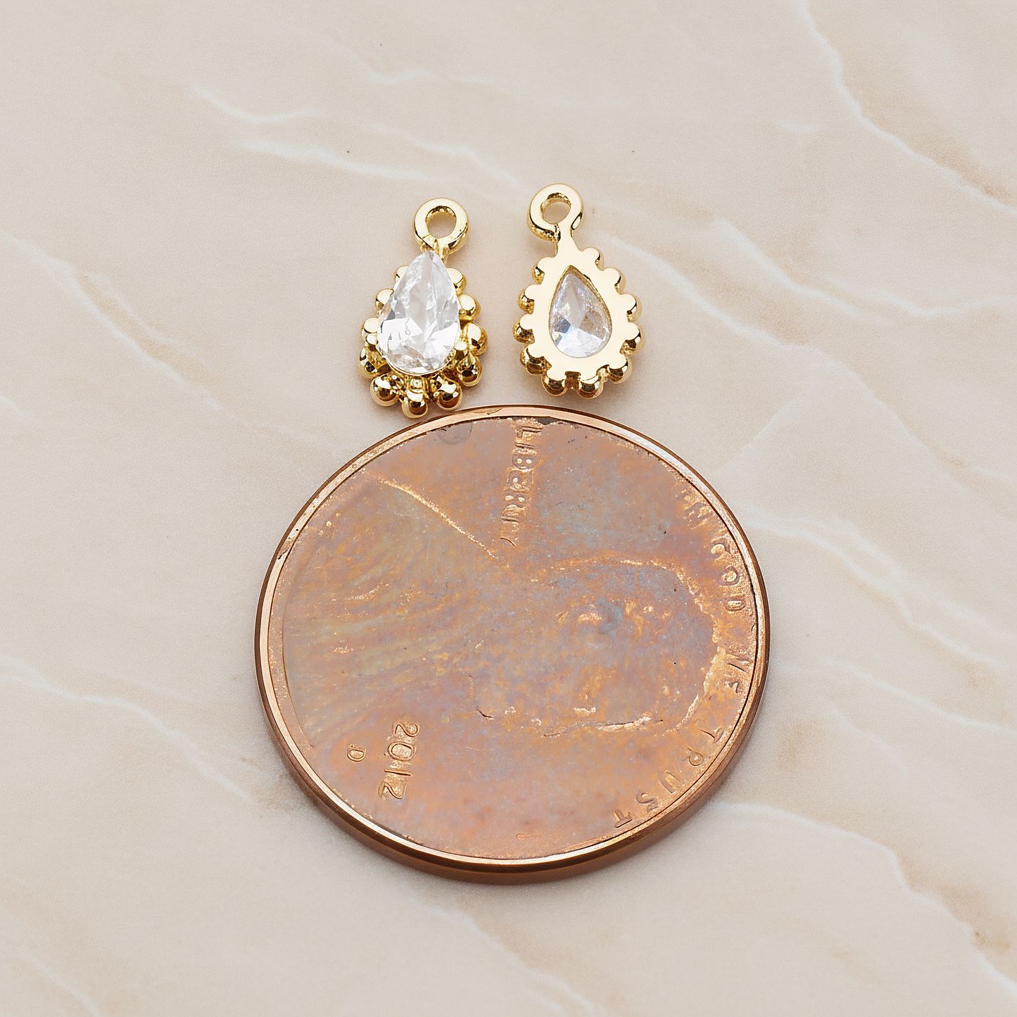 Teardrop Framed Cubic Setting Pendant, 2 Pc on warm marble background (PD.1076)