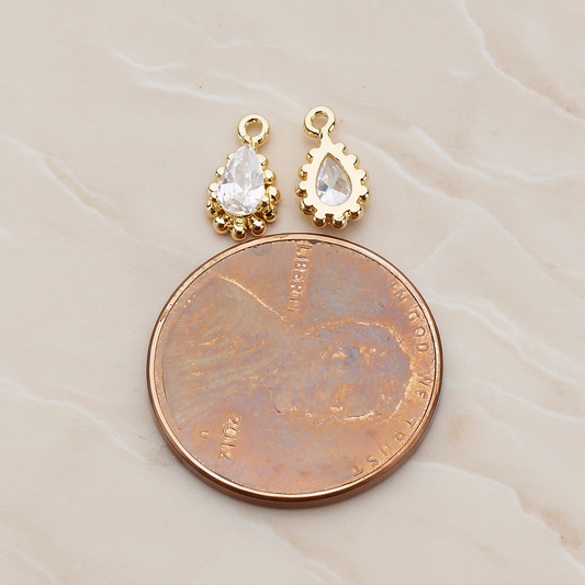 Teardrop Framed Cubic Setting Pendant, 2 Pc on warm marble background (PD.1076)
