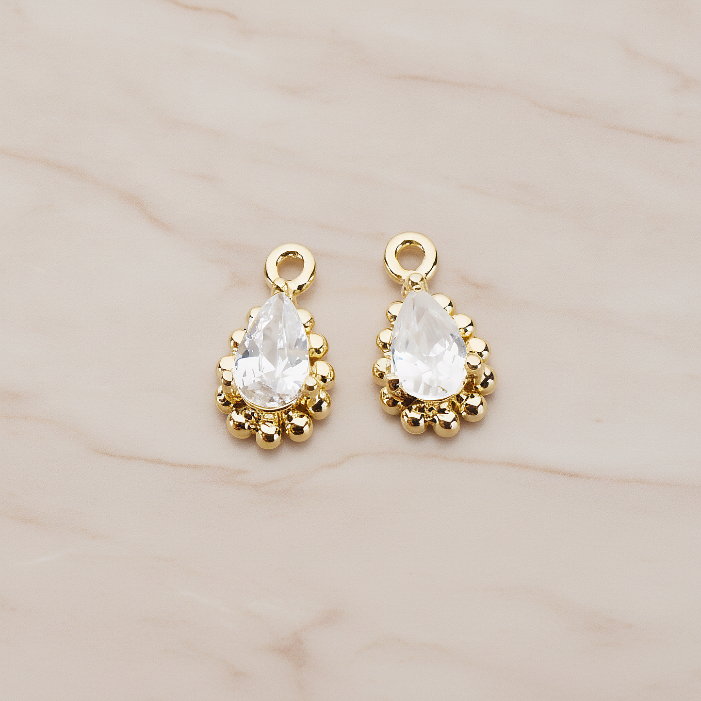 Teardrop Framed Cubic Setting Pendant, 2 Pc on warm marble background (PD.1076)