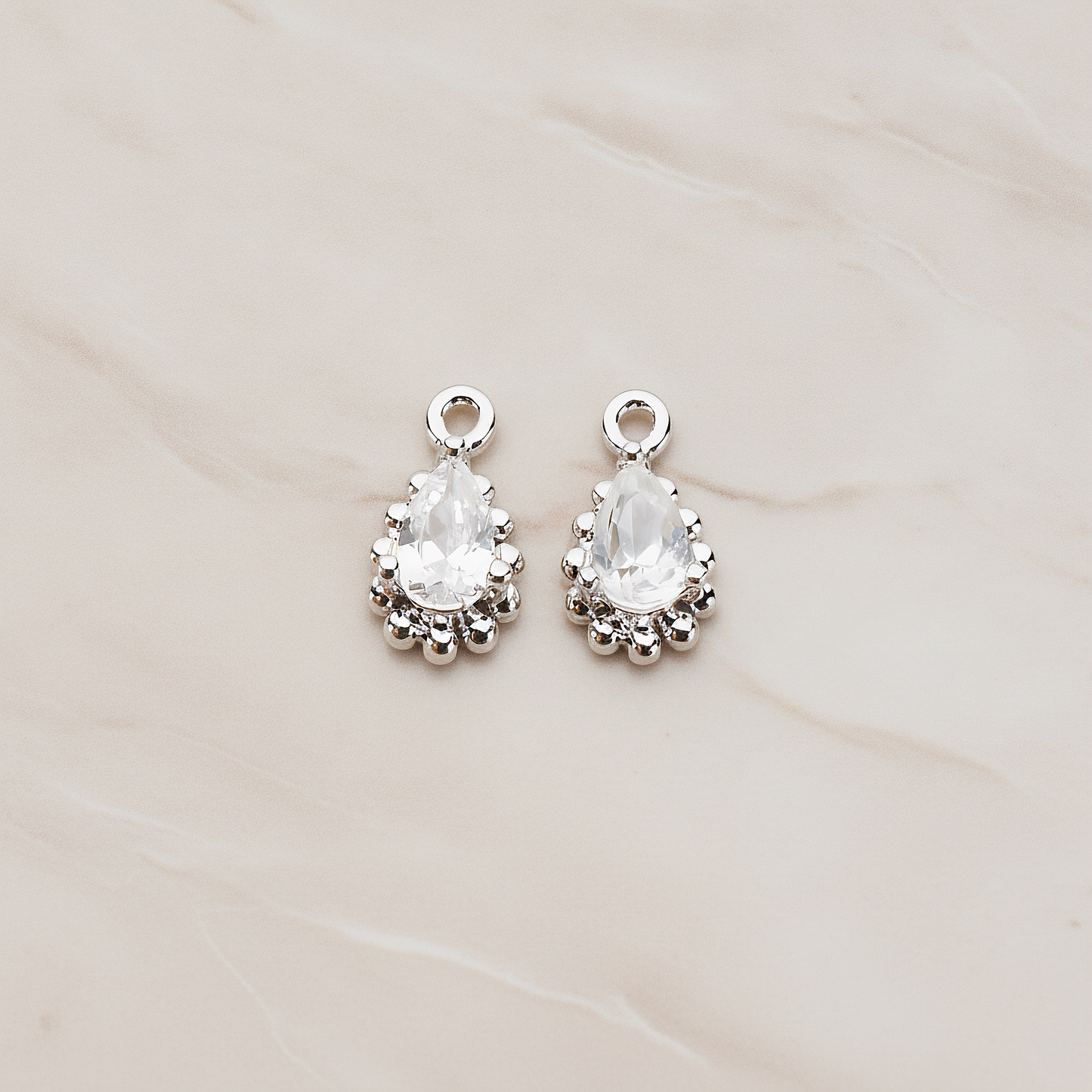 Teardrop Framed Cubic Setting Pendant, 2 Pc on warm marble background (PD.1076)