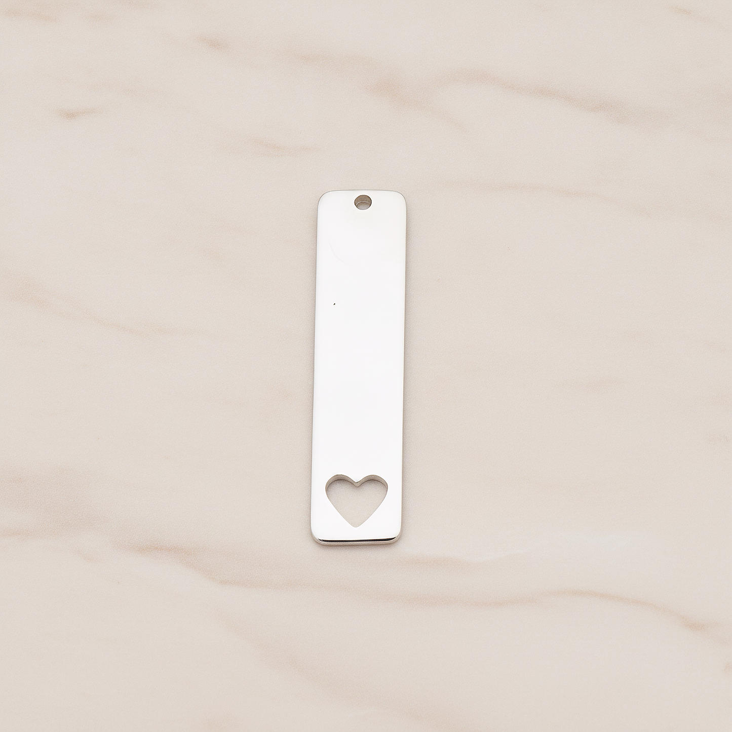 Vertical Heart Silhouette Bar Pendant, 2 Pc on warm marble background (PD.1150)