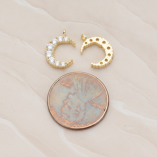 Round Crystal Cut Cubic Zirconia Crescent Moon Pendant, 2 Pc on warm marble background (PD.1174)