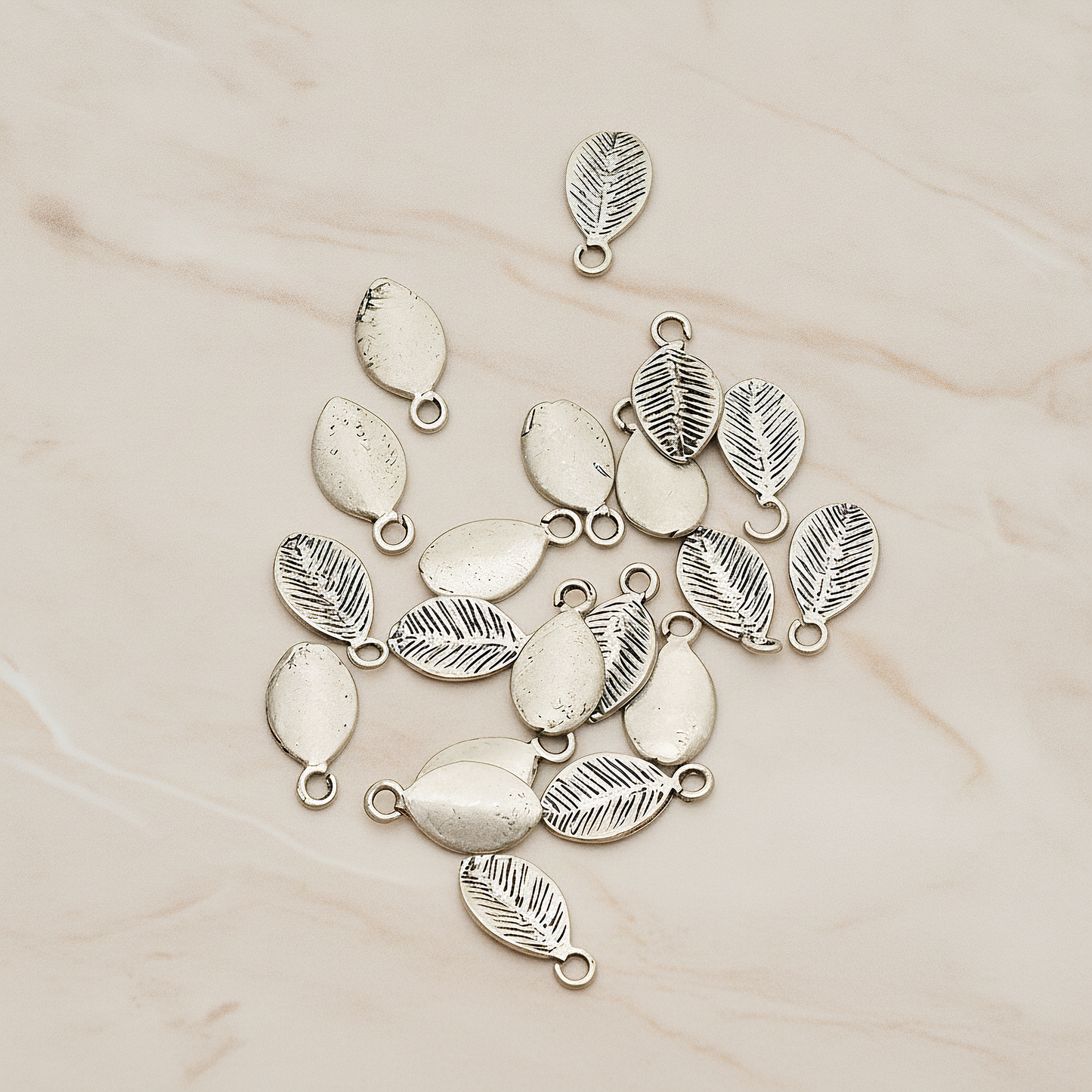 Mini Oval Leaf Pendant, 6 Pc on warm marble background (PD.1208)