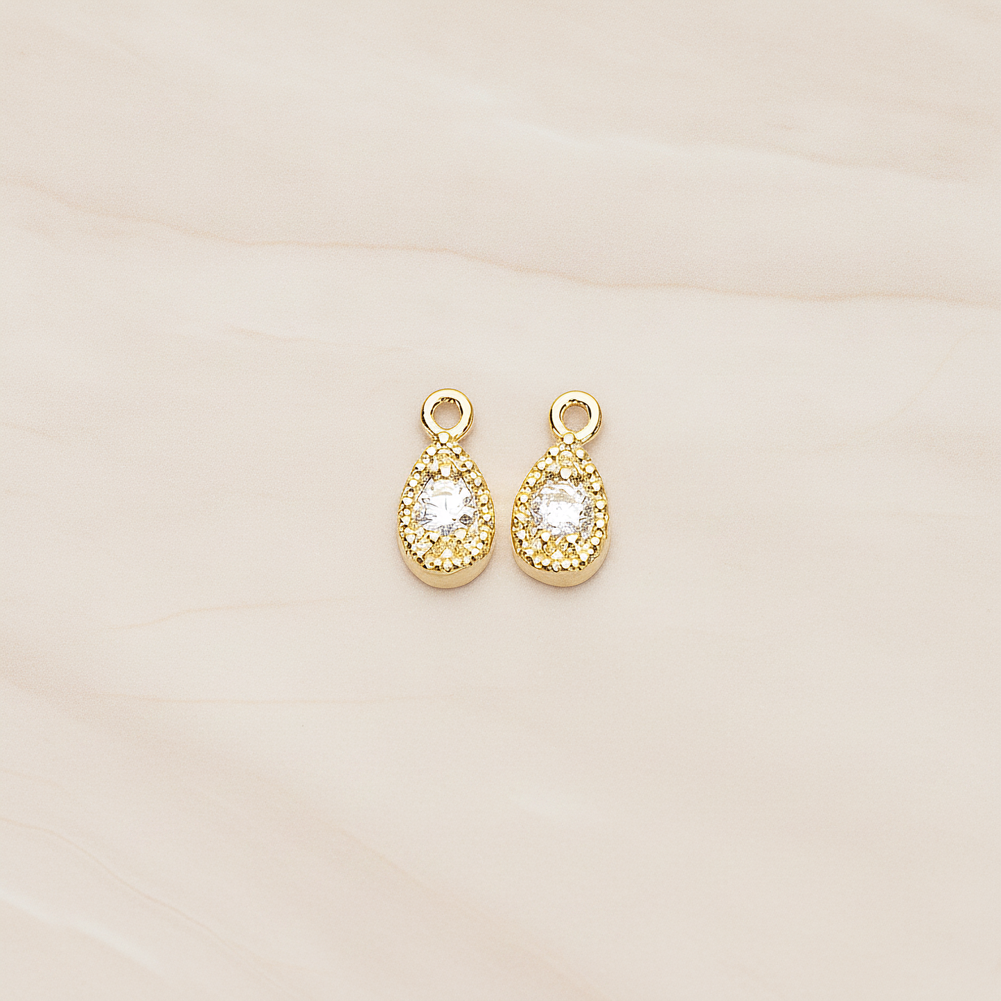 Oval Cubic Setting Textured Frame Mini Teardrop Pendant, 2 Pc on warm marble background (PD.1389)