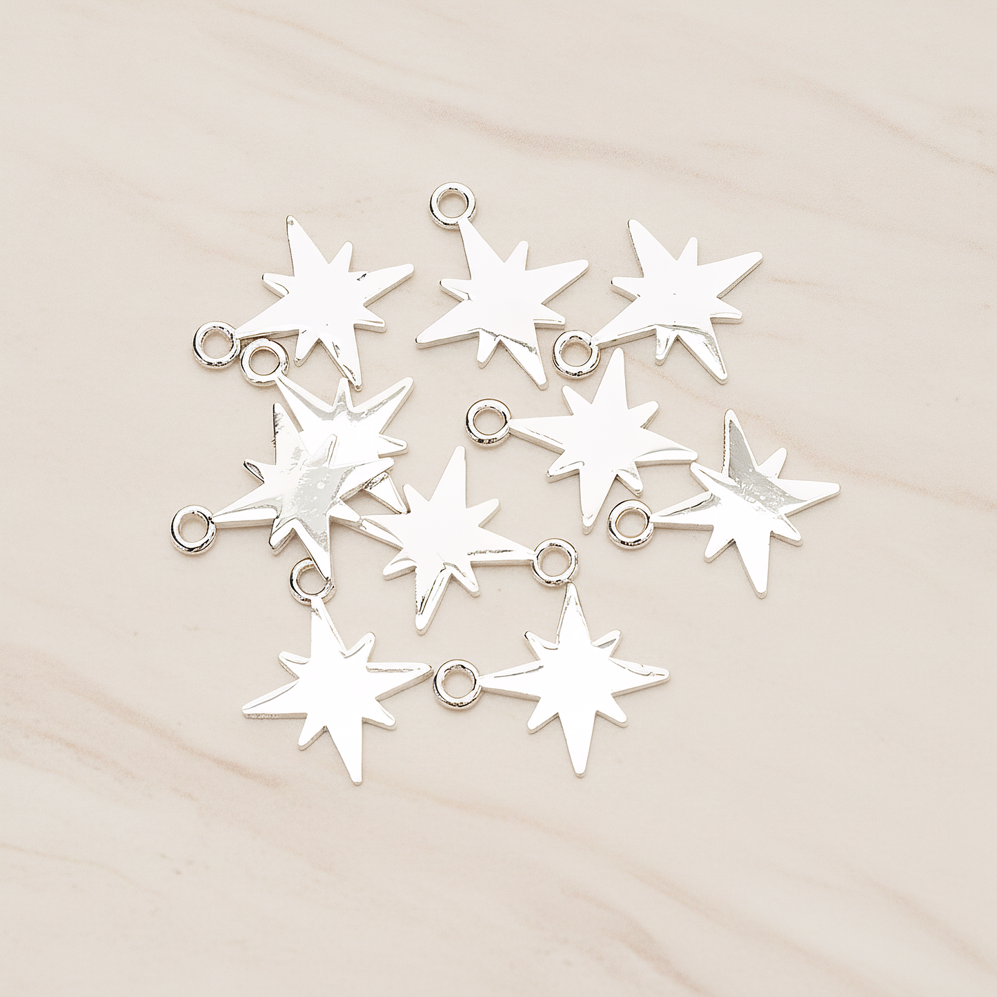 Simple Bright Shinny Star Charm Pendant, 2 Pc on warm marble background (PD.1480)