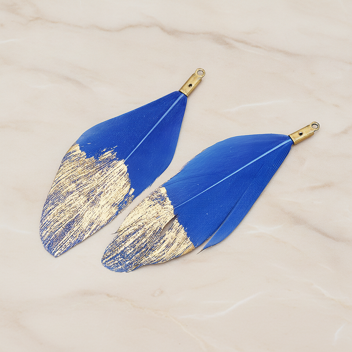 Artificiality Feather Half Dipped in Gold Pendant, 2 Pc on warm marble background (PD.1492-01)