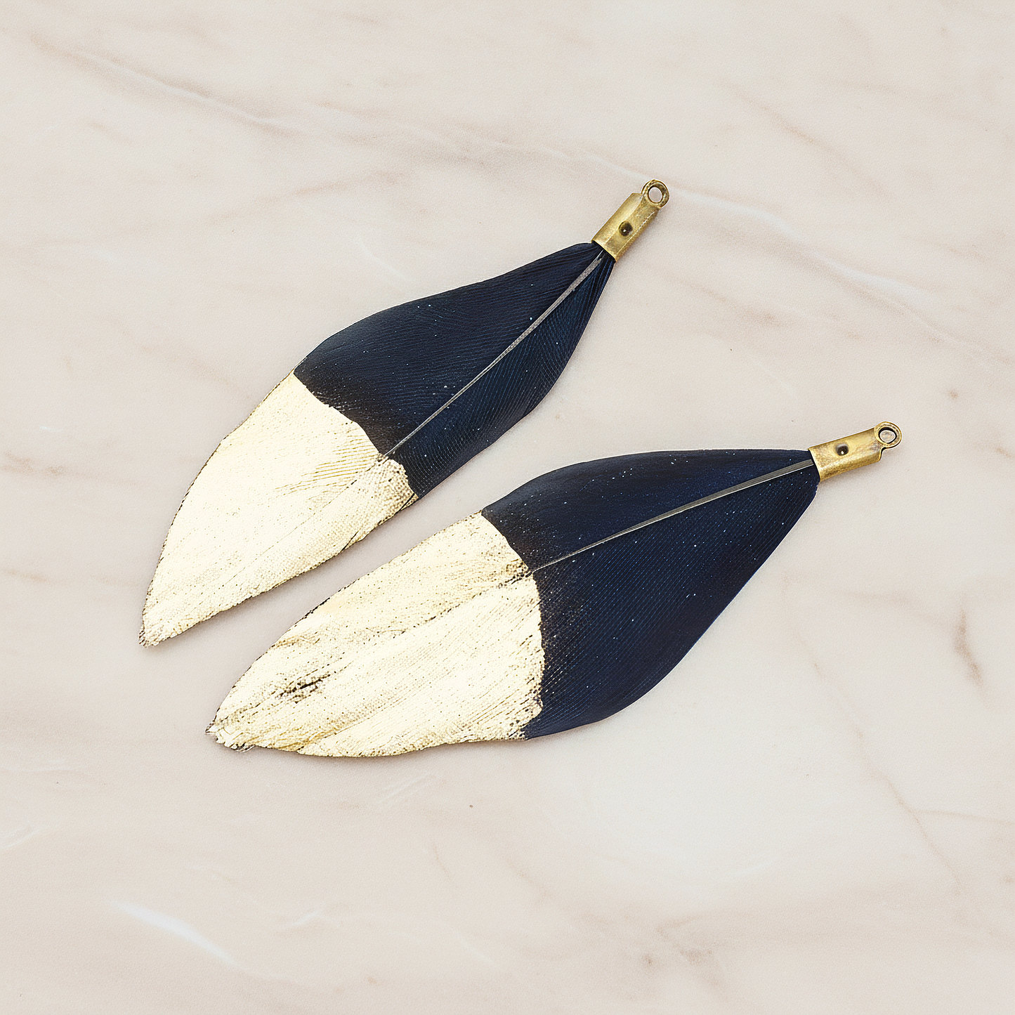 Artificiality Feather Half Dipped in Gold Pendant, 2 Pc on warm marble background (PD.1492-01)