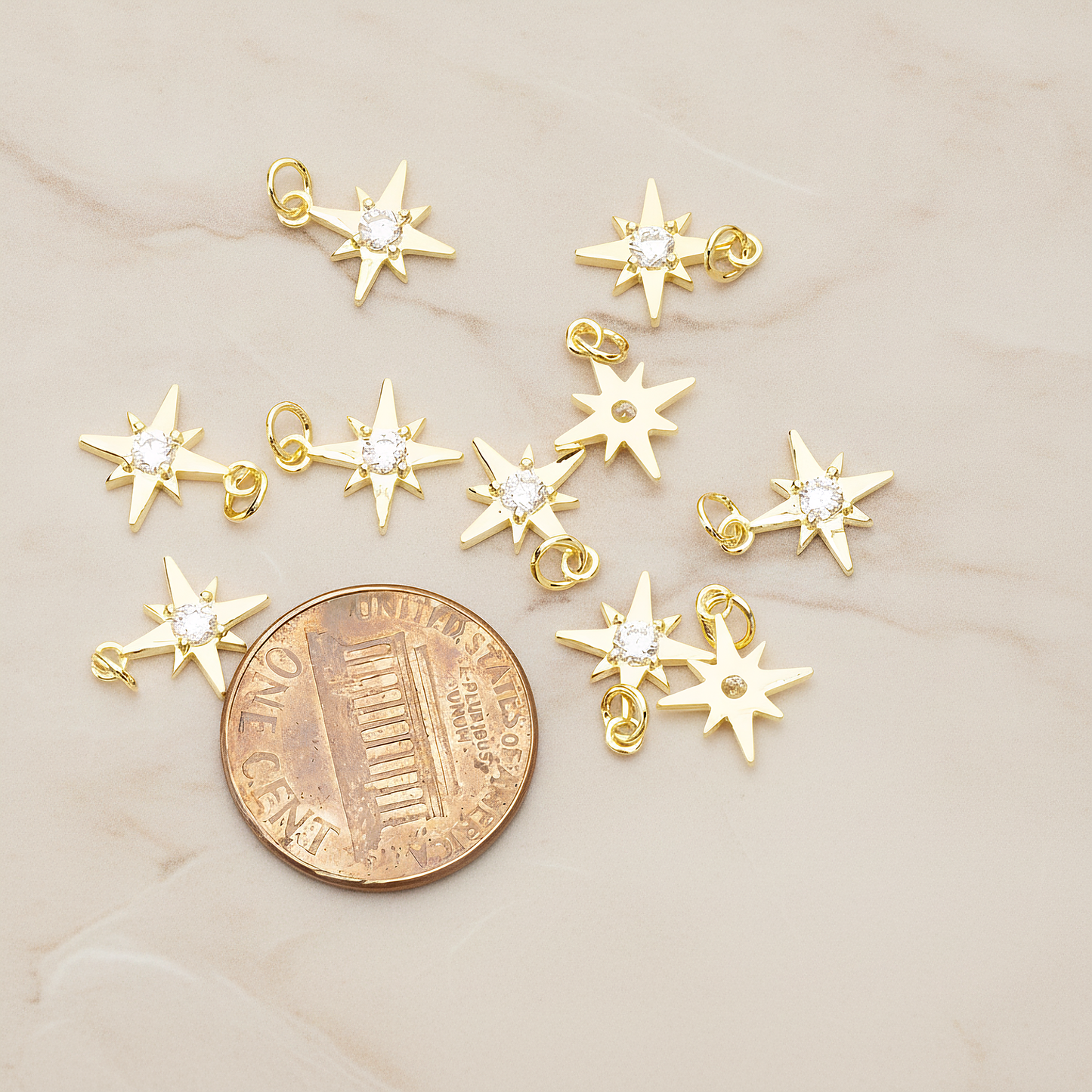 Shiny Star Cubic Setting Pendant, 2 Pc on warm marble background (PD.1633)