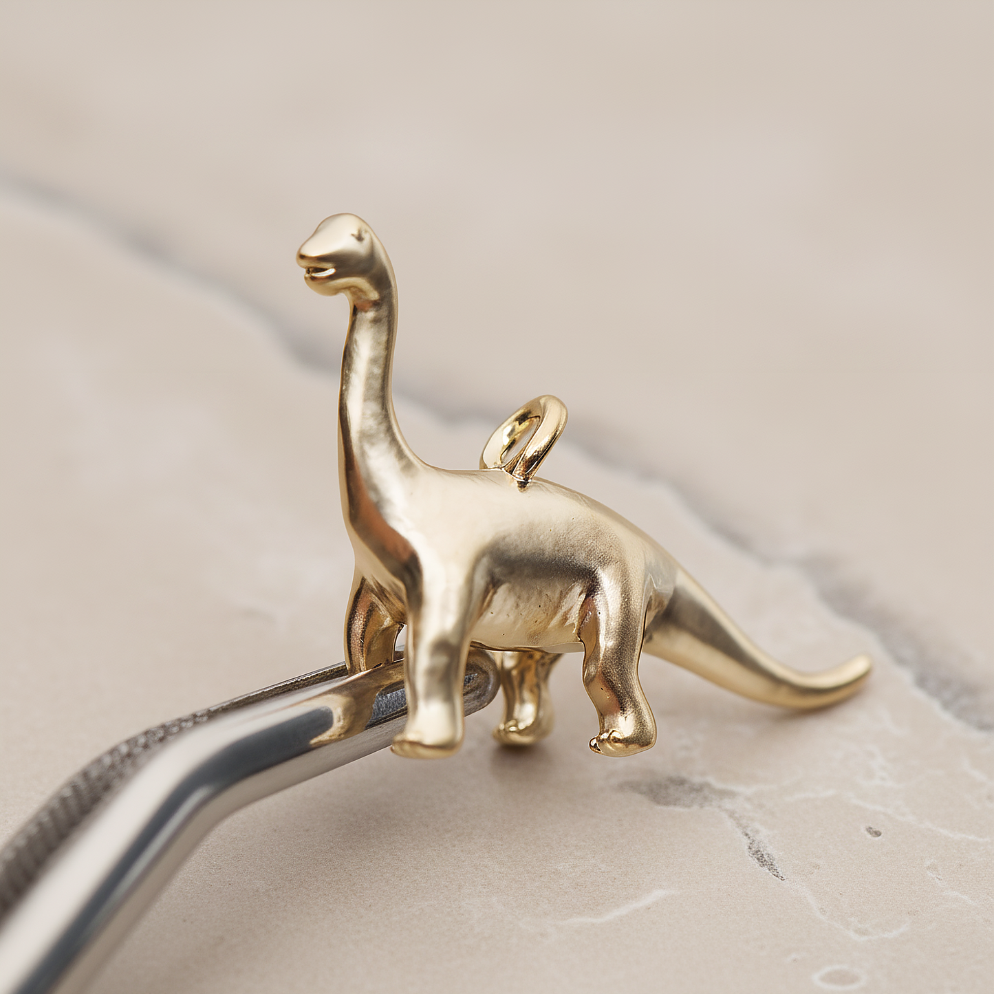 Brachiosaurus, Dinosaur Pendant, 2 Pc on warm marble background (PD.1799)