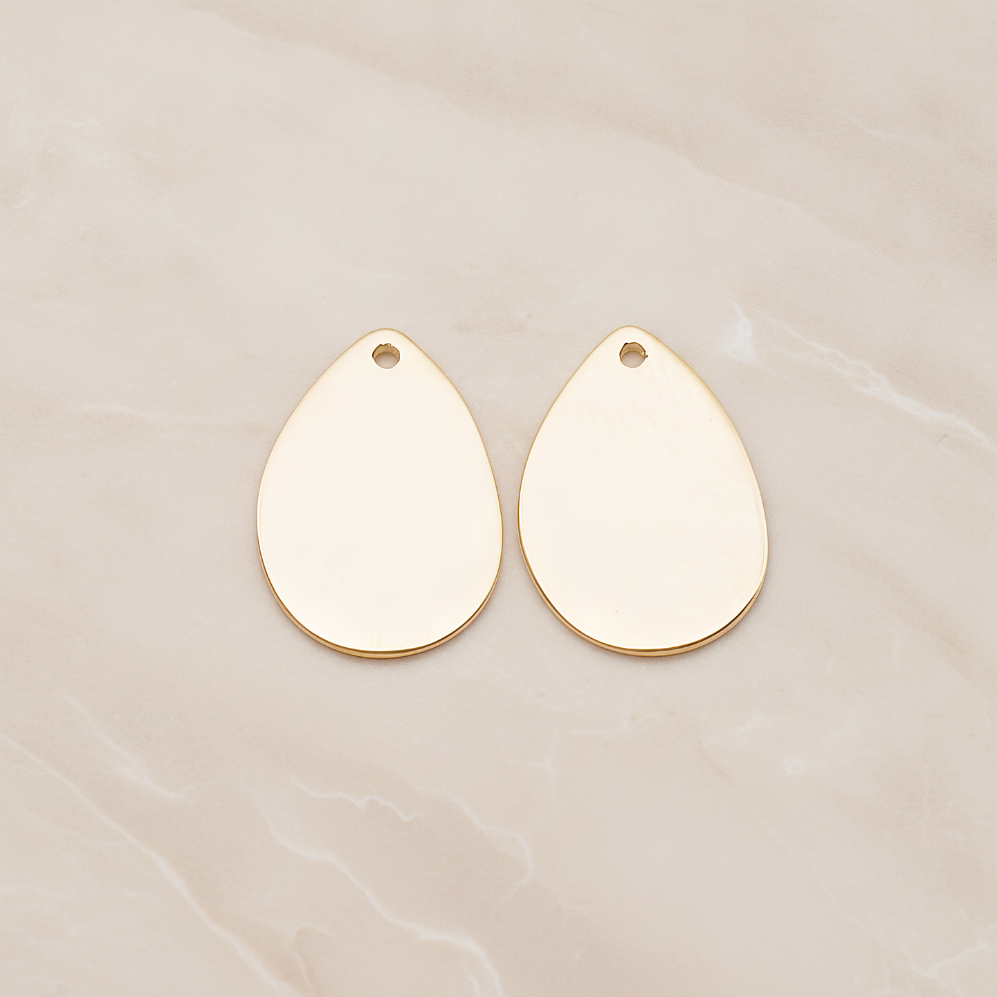 Small Teardrop Stamped Hammered Pendant, 2 Pc on warm marble background (PD.1826-01)