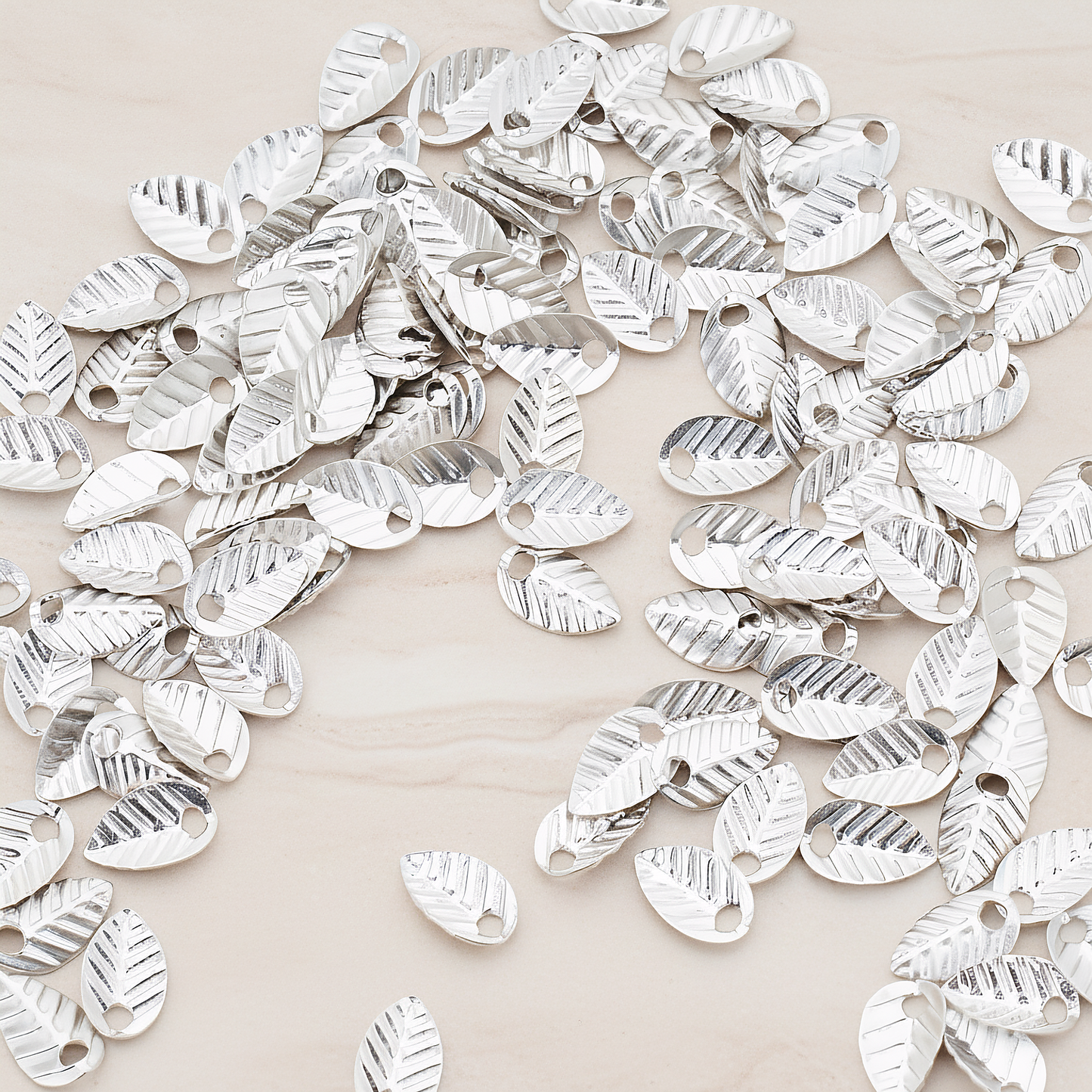 Half Fold Tiny Leaf Charm, 20 Pc on warm marble background (PD.222)
