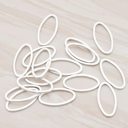 8 X 16 Mm Simple Oval Link Pendant, 4 Pc on warm marble background (PD.304-03)