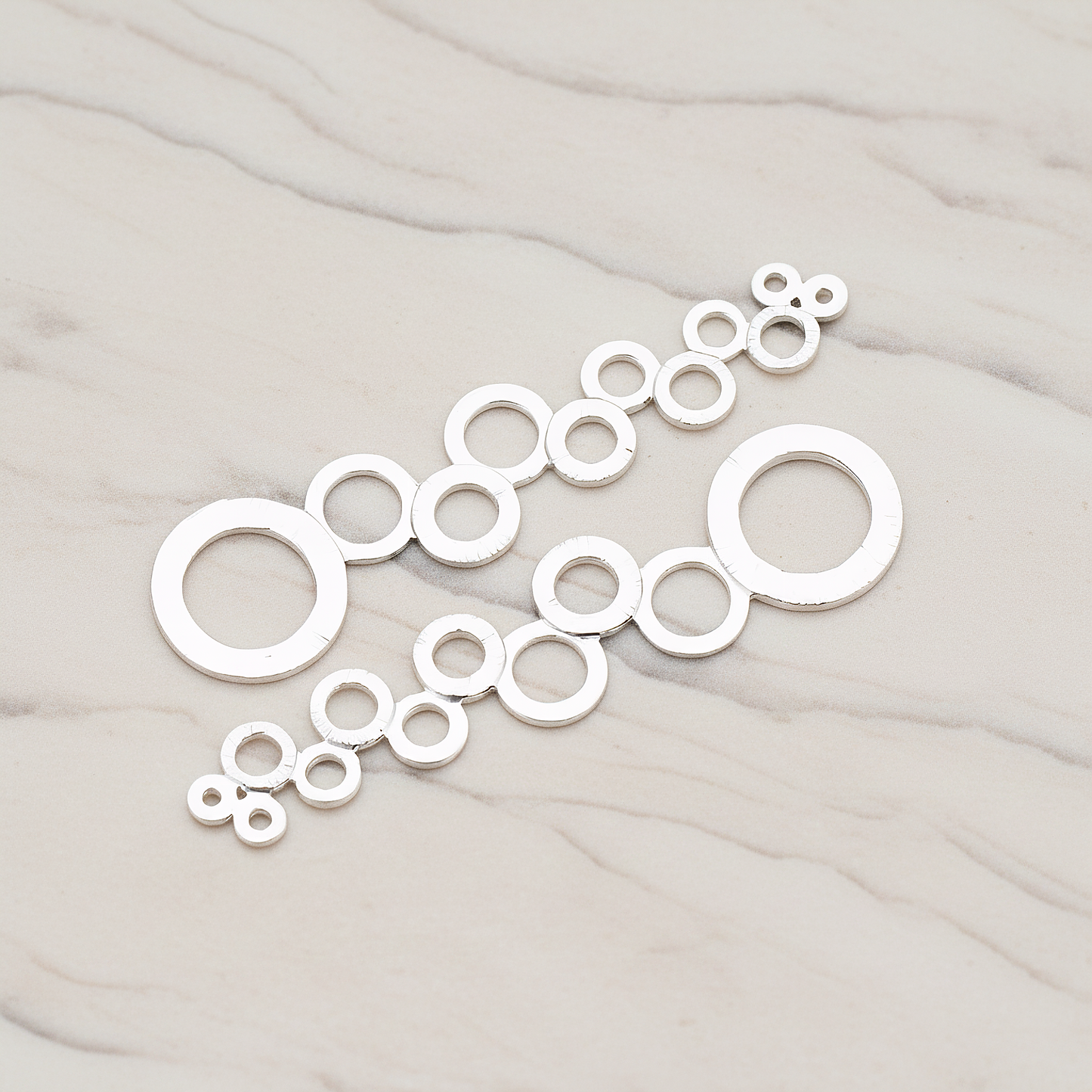 Brushed Multi Circle Stream Pendant, 2 Pc on warm marble background (PD.318-05)