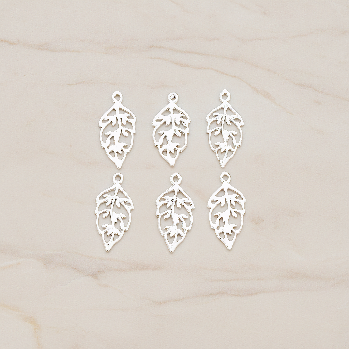 Unique Leaf Pendant, 4 Pc on warm marble background (PD.549)