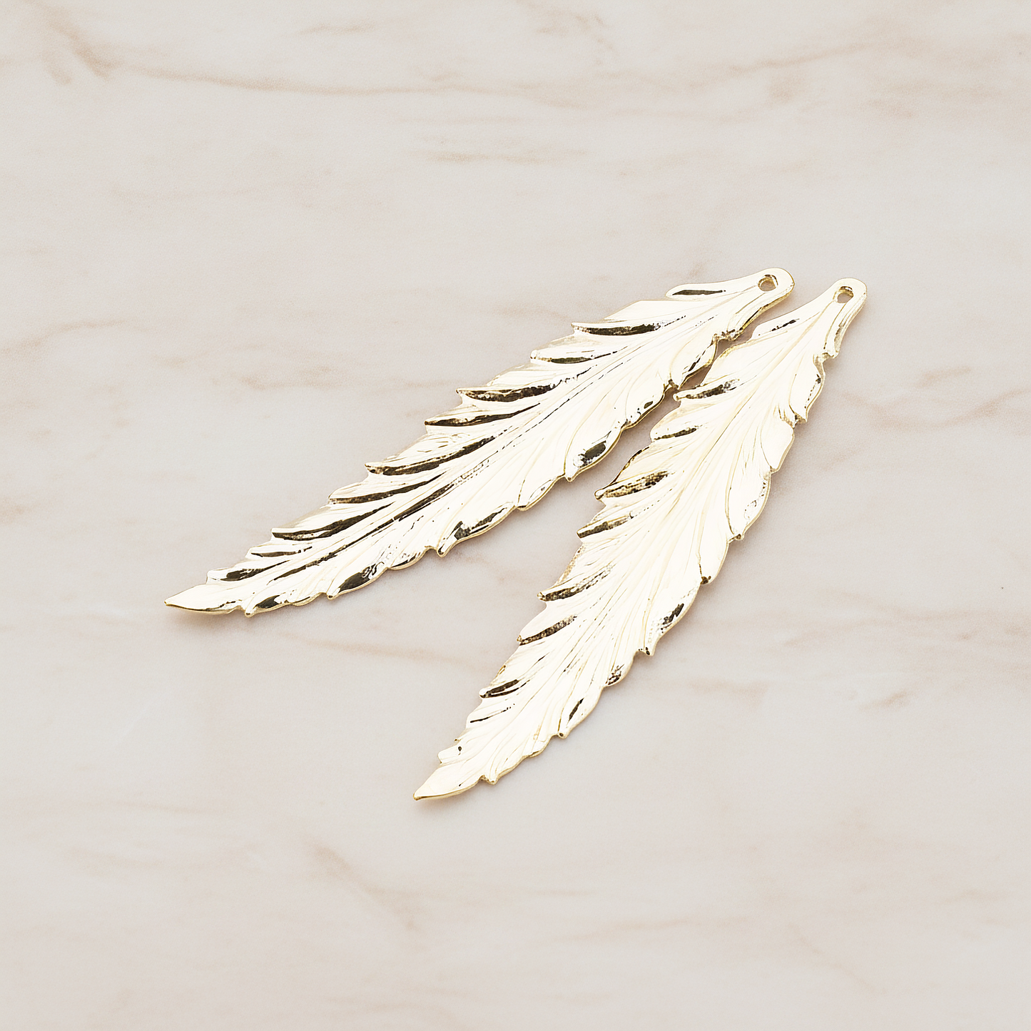 Thin Long Leaf Pendant, 2 Pc on warm marble background (PD.575-02)