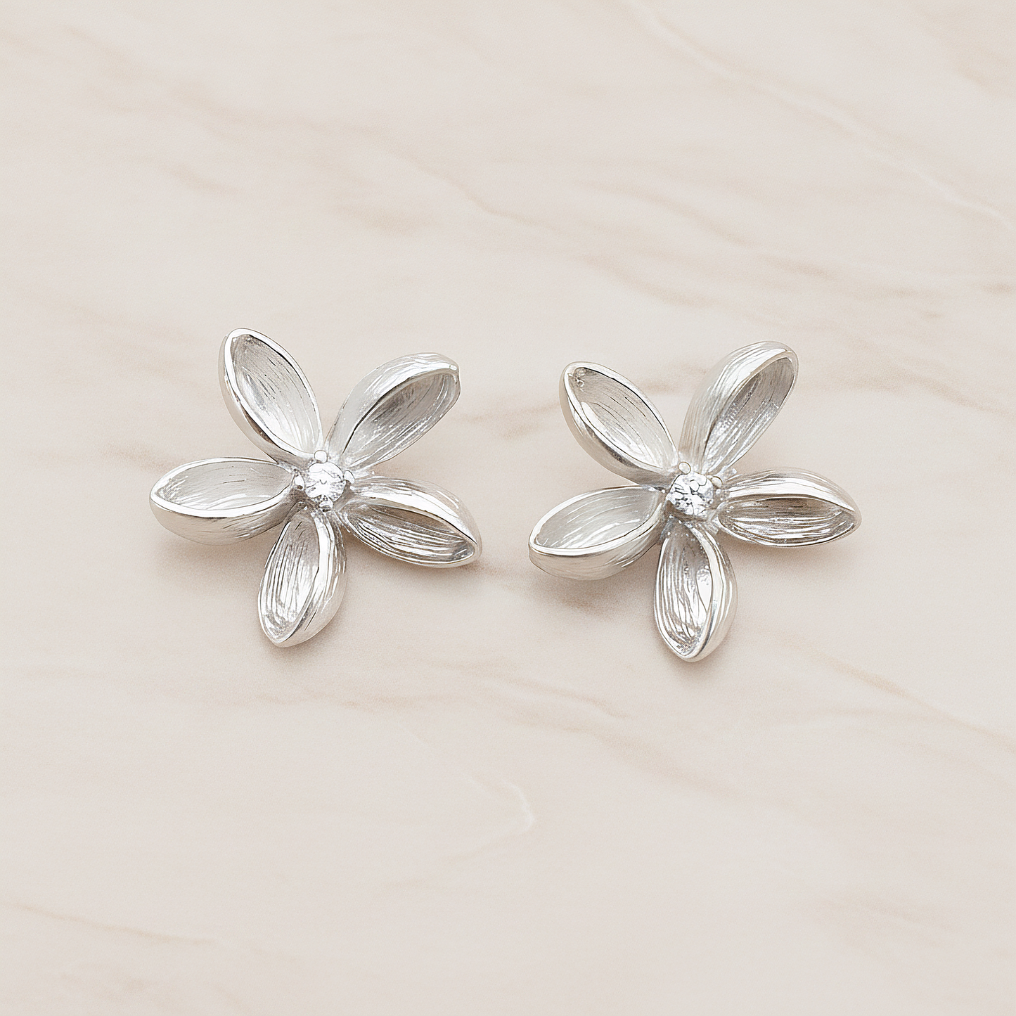 Clear Crystal Cubic Zirconia Centered Flower Pendant, 2 Pc on warm marble background (PD.592)