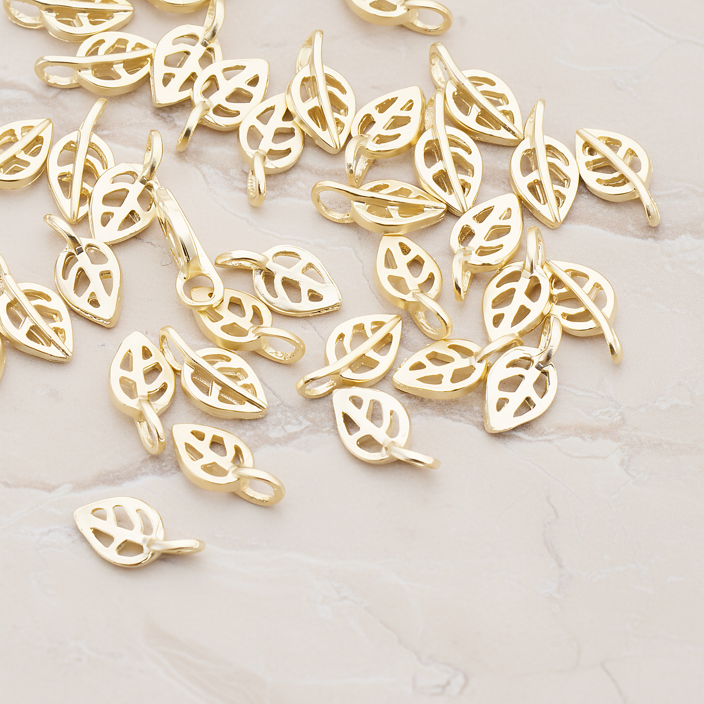Mini Leaf Pendant, 4 Pc on warm marble background (PD.606)
