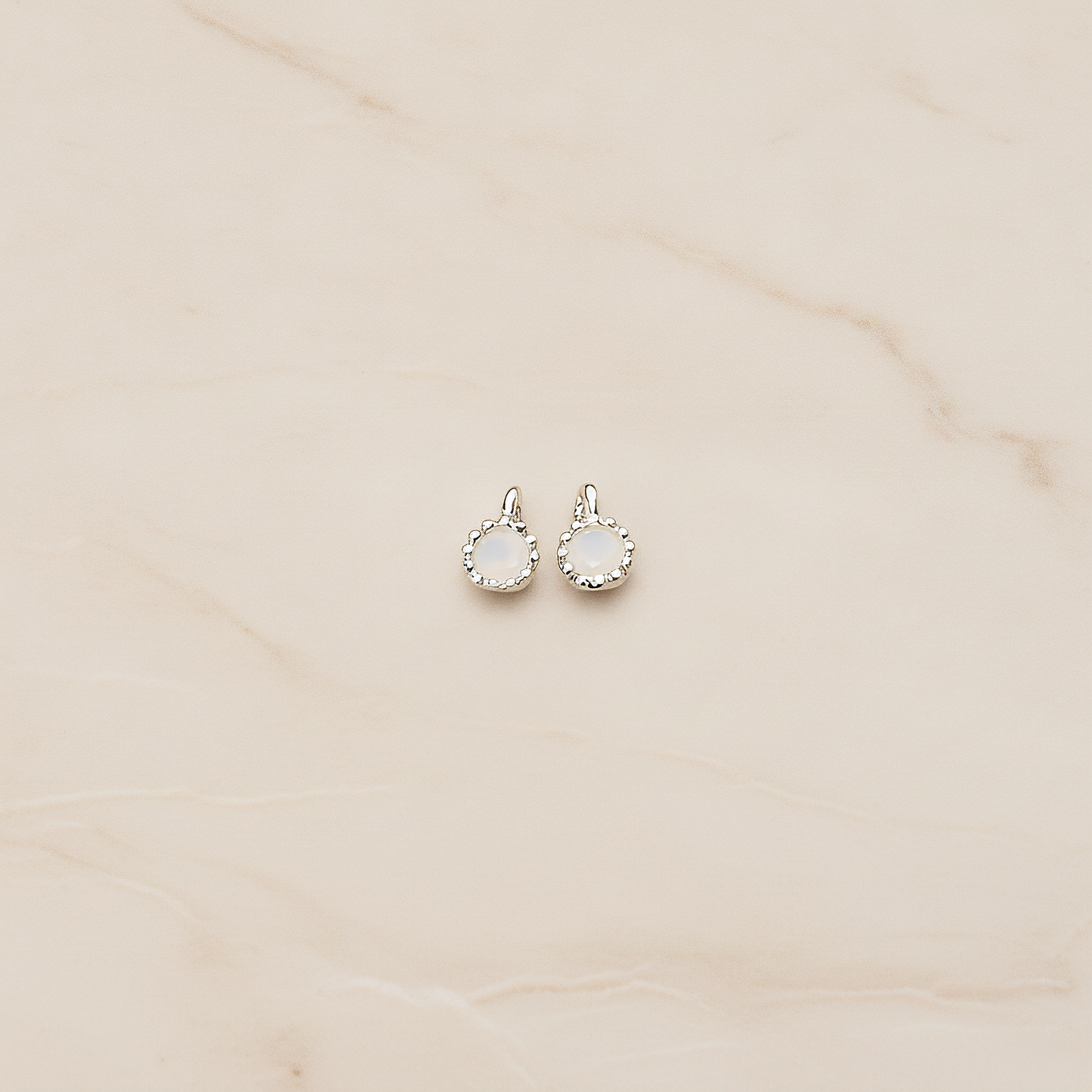 Cubic Zirconia Textured Framed Charm Pendant, 2 Pc on warm marble background (PD.780)