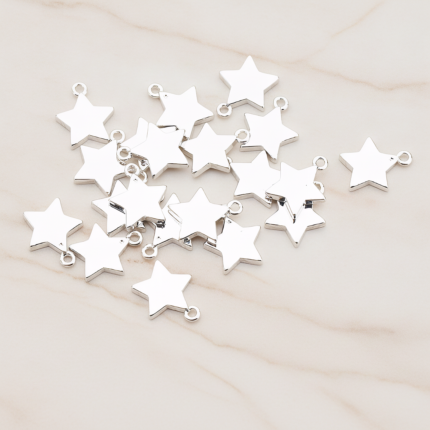 Mini Star Pendant, 2 Pc on warm marble background (PD.925)