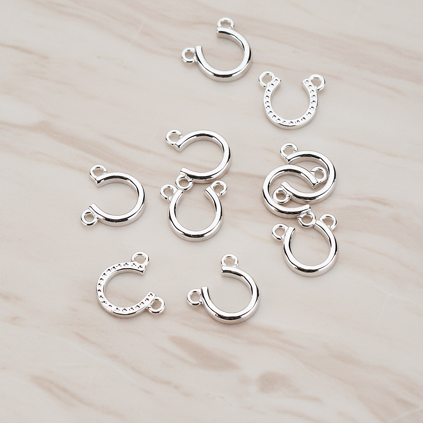 Plated Small Simple Horseshoe Pendant, 2 Pc on warm marble background (PD.996-01)