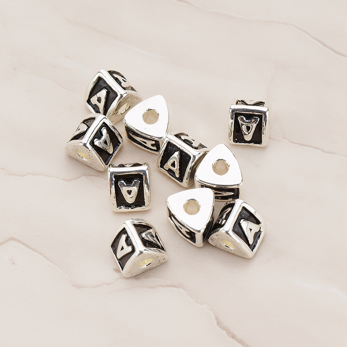 Triangle Cube Initial Metal Bead, 2 Pc on warm marble background (PD.1136)