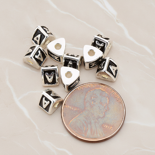 Triangle Cube Initial Metal Bead, 2 Pc on warm marble background (PD.1136)