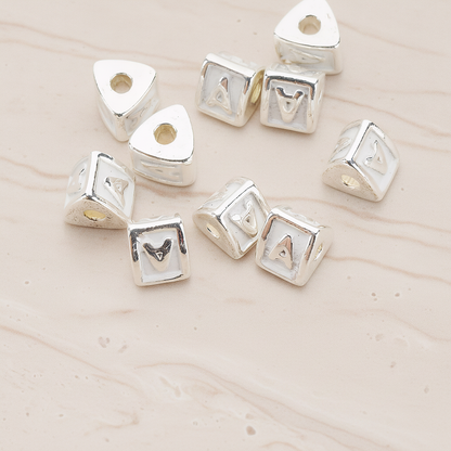 Triangle Cube Initial Metal Bead, 2 Pc on warm marble background (PD.1136)