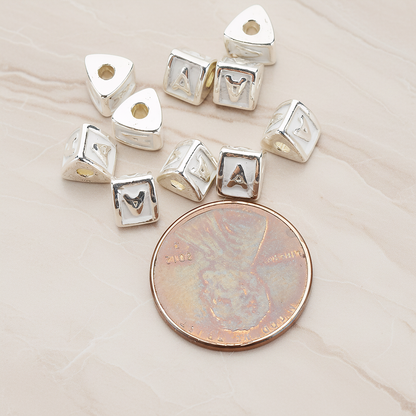 Triangle Cube Initial Metal Bead, 2 Pc on warm marble background (PD.1136)