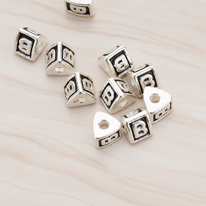 Triangle Cube Initial Metal Bead, 2 Pc on warm marble background (PD.1136)