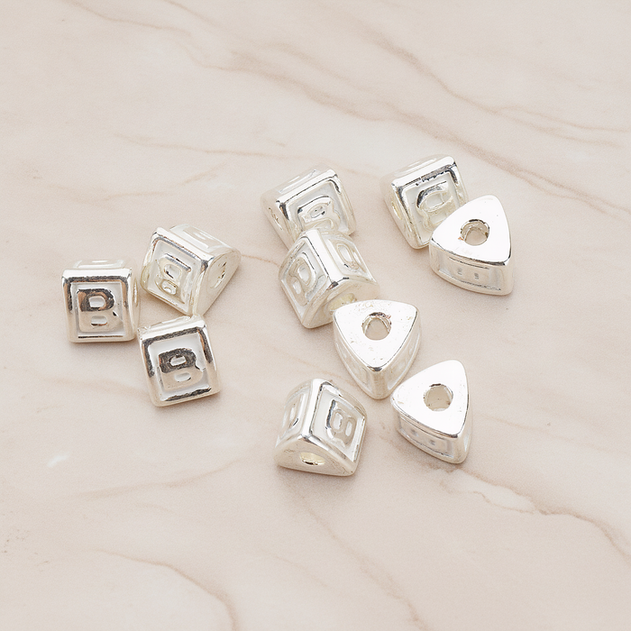 Triangle Cube Initial Metal Bead, 2 Pc on warm marble background (PD.1136)