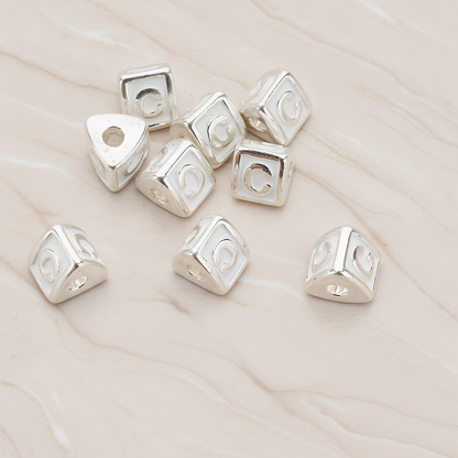 Triangle Cube Initial Metal Bead, 2 Pc on warm marble background (PD.1136)