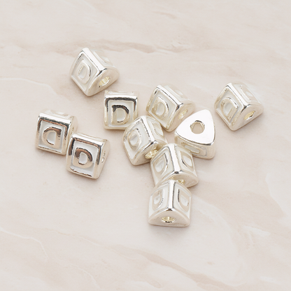 Triangle Cube Initial Metal Bead, 2 Pc on warm marble background (PD.1136)