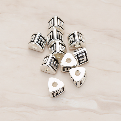 Triangle Cube Initial Metal Bead, 2 Pc on warm marble background (PD.1136)