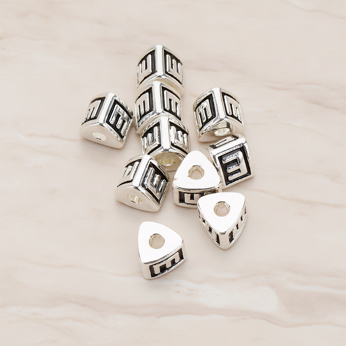 Triangle Cube Initial Metal Bead, 2 Pc on warm marble background (PD.1136)