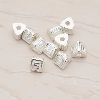 Triangle Cube Initial Metal Bead, 2 Pc on warm marble background (PD.1136)