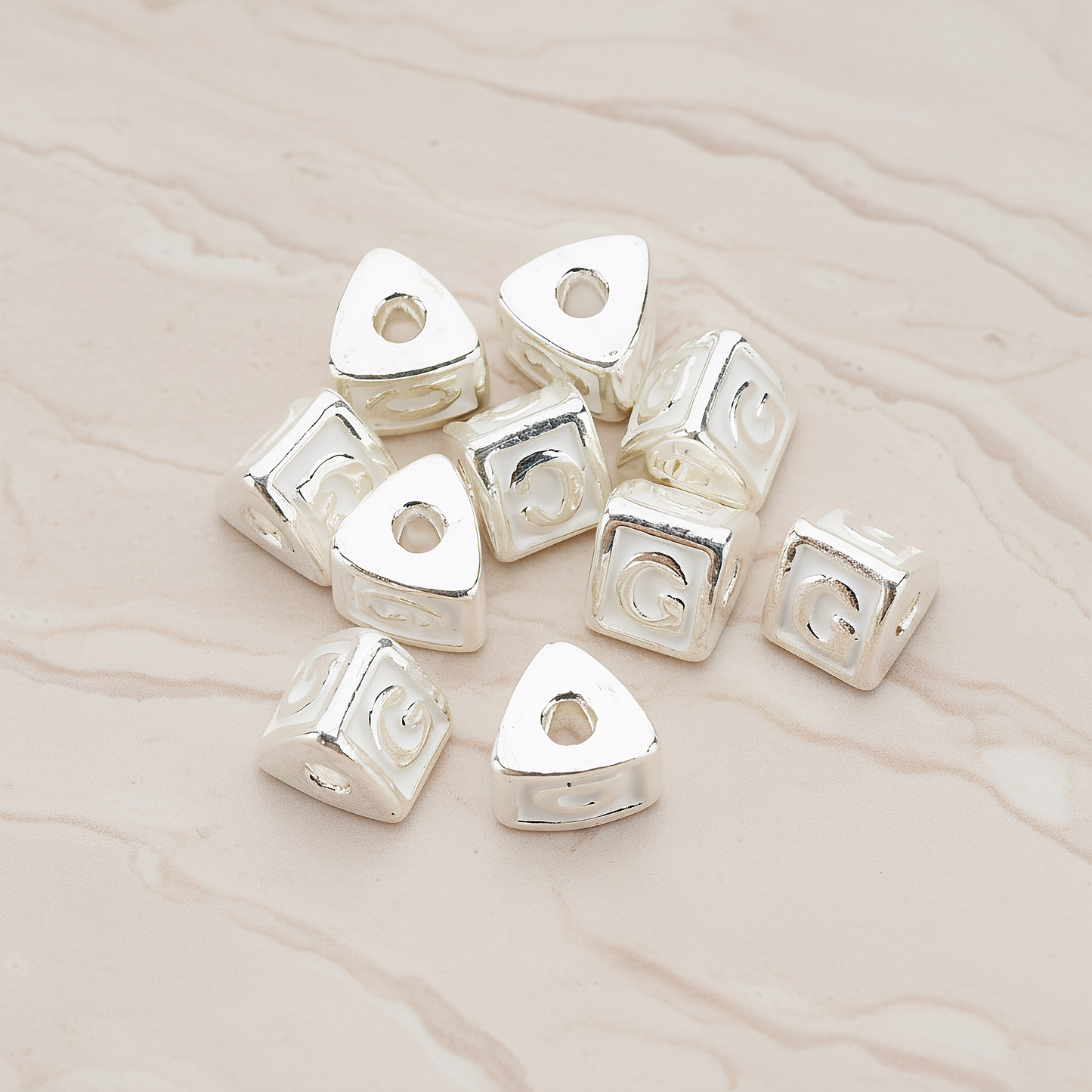 Triangle Cube Initial Metal Bead, 2 Pc on warm marble background (PD.1136)