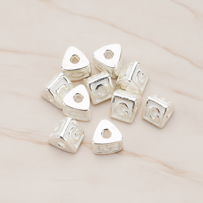 Triangle Cube Initial Metal Bead, 2 Pc on warm marble background (PD.1136)