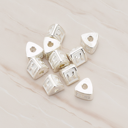 Triangle Cube Initial Metal Bead, 2 Pc on warm marble background (PD.1136)