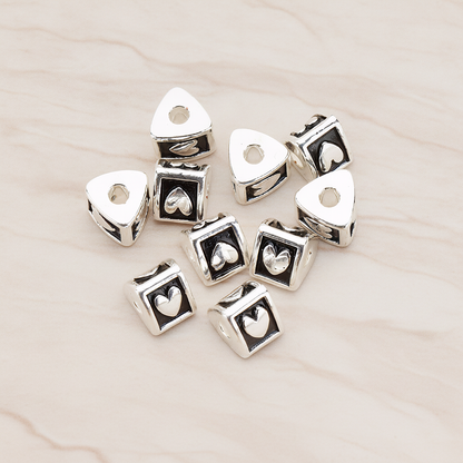 Triangle Cube Initial Metal Bead, 2 Pc on warm marble background (PD.1136)